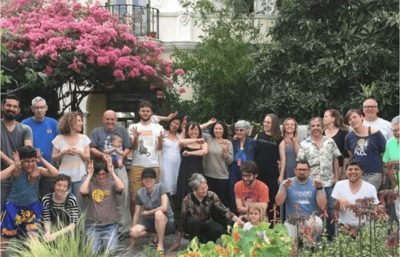 Members of the Urban Soil / Tierra Urbana community gathered together in the courtyard
